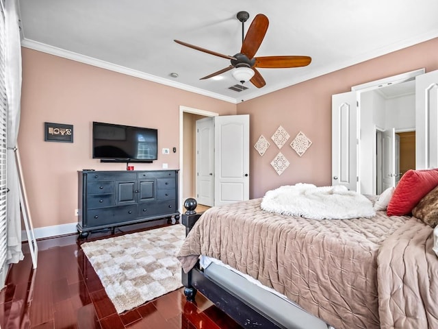 bedroom with dark hardwood / wood-style flooring, ceiling fan, and crown molding