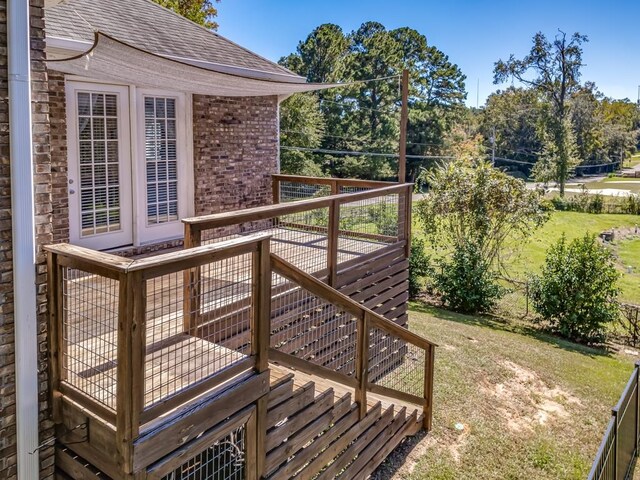 wooden deck with a yard