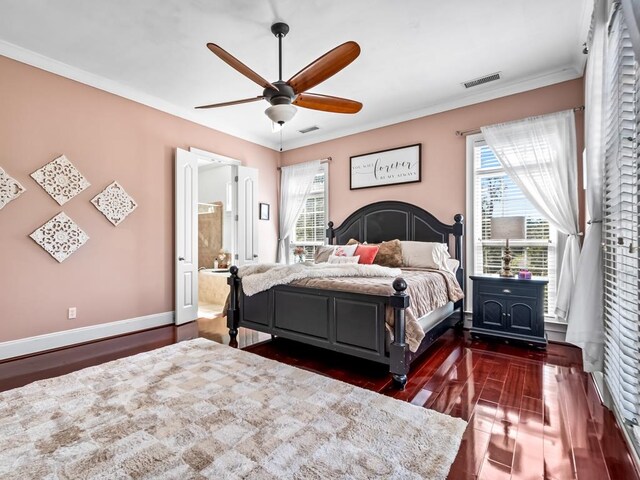 bedroom with ensuite bathroom, dark hardwood / wood-style flooring, ceiling fan, and crown molding