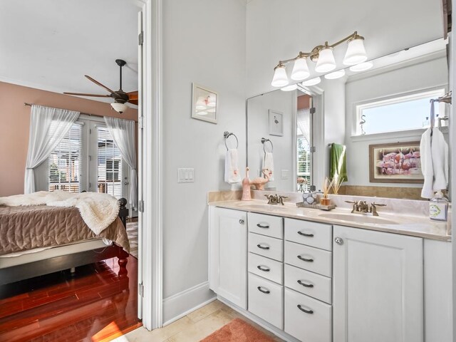 bathroom featuring hardwood / wood-style flooring, ceiling fan, and vanity