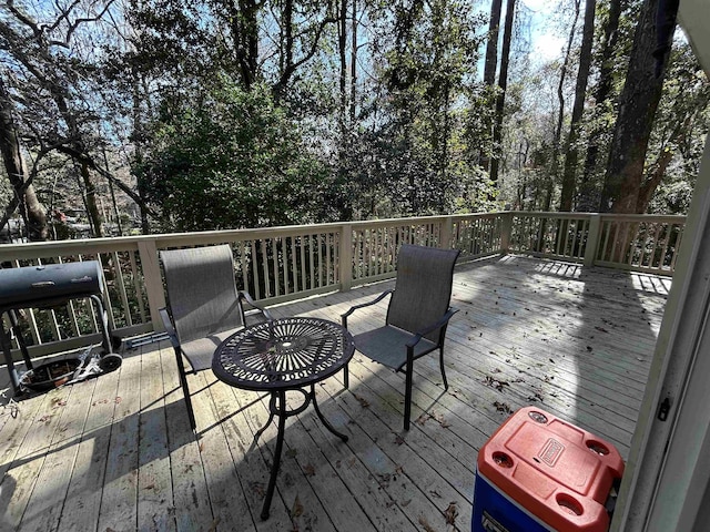 wooden deck featuring grilling area