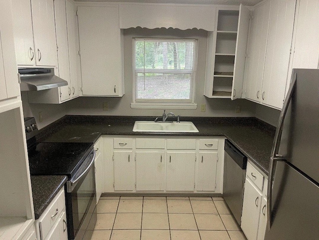 kitchen featuring white cabinetry, stainless steel appliances, light tile patterned floors, and sink