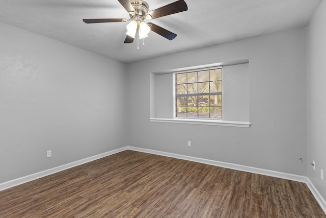 unfurnished room with dark hardwood / wood-style flooring and ceiling fan