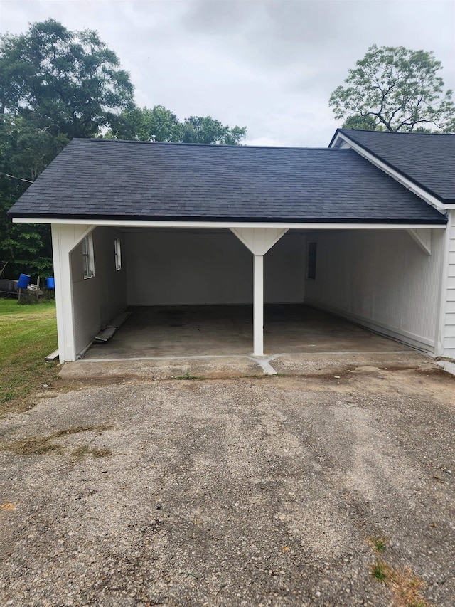 view of parking / parking lot with a carport