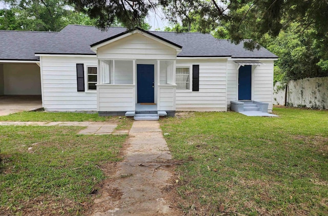 118 N Virginia St, Quincy, FL 32351 - bungalow with roof with shingles, entry steps, and an attached carport