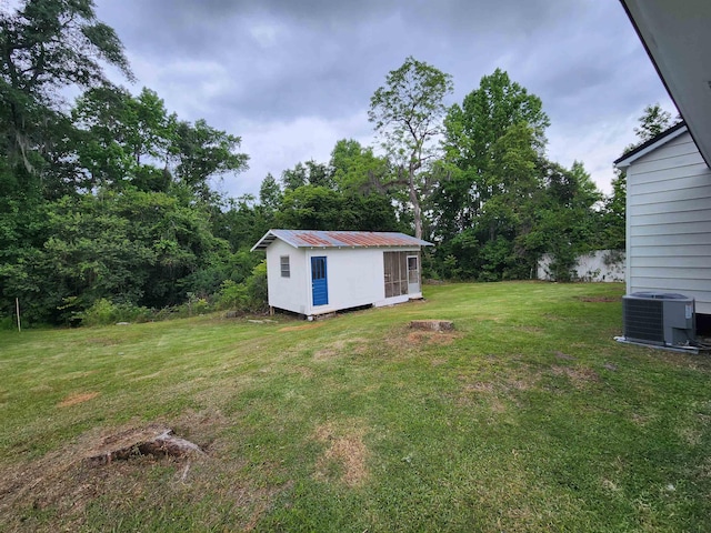 118 N Virginia St, Quincy, FL 32351 - view of green lawn with central AC unit and an outbuilding