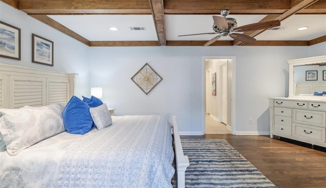 bedroom with visible vents, baseboards, coffered ceiling, wood finished floors, and beam ceiling