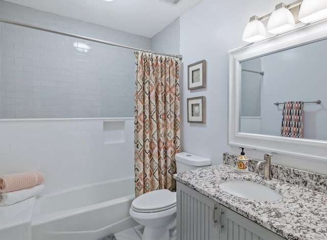 full bath with shower / tub combo, vanity, and toilet