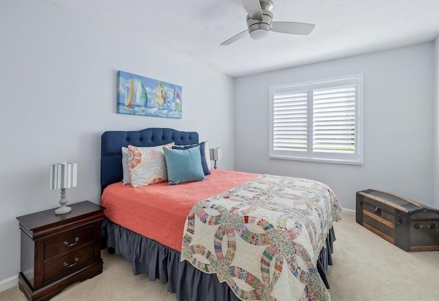 bedroom with a ceiling fan, carpet, and baseboards