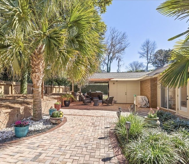 view of patio featuring fence