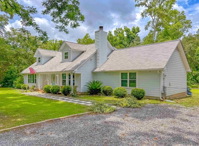 7420 Hickock Ct, Tallahassee, FL 32311 - new england style home with a chimney and roof with shingles