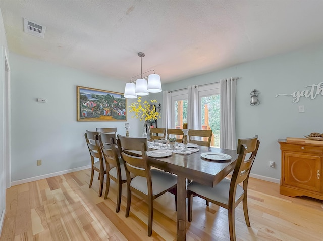 7420 Hickock Ct, Tallahassee, FL 32311 - dining area with light wood-style flooring and baseboards