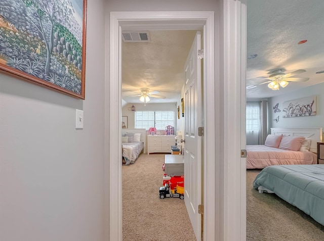 7420 Hickock Ct, Tallahassee, FL 32311 - carpeted bedroom with a ceiling fan and a textured ceiling