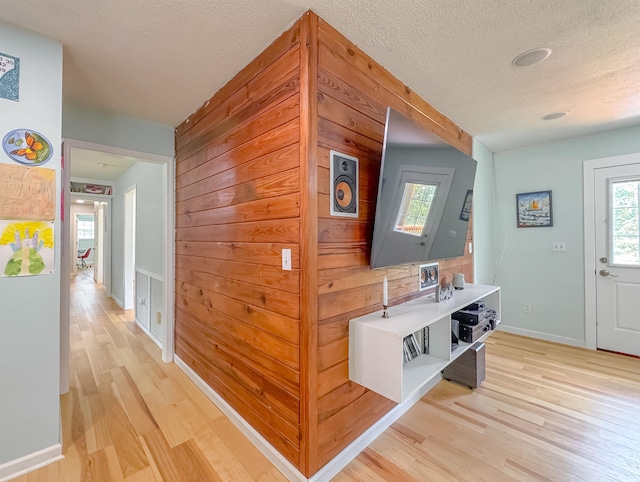 7420 Hickock Ct, Tallahassee, FL 32311 - hall with light wood-type flooring, plenty of natural light, and a textured ceiling