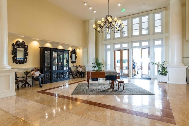 9500 Grand Sandestin Blvd Unit 2103, Walton Beaches, FL 32550 - community lobby featuring a high ceiling, a decorative wall, and a wainscoted wall