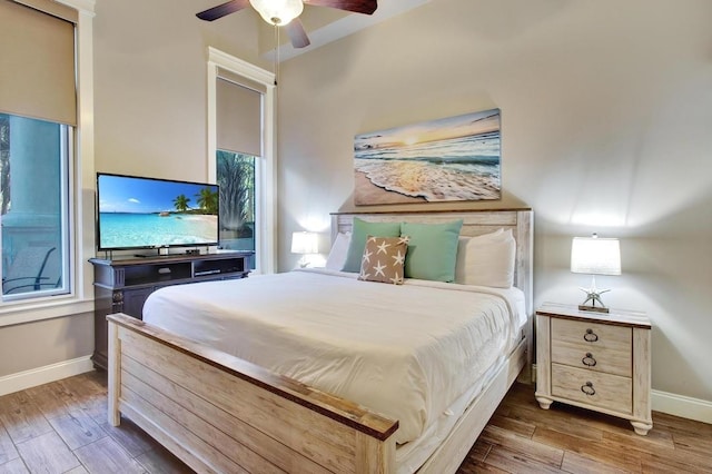 9500 Grand Sandestin Blvd Unit 2103, Walton Beaches, FL 32550 - bedroom with wood finished floors, baseboards, and a ceiling fan