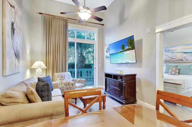 9500 Grand Sandestin Blvd Unit 2103, Walton Beaches, FL 32550 - living area featuring ceiling fan, a towering ceiling, and baseboards