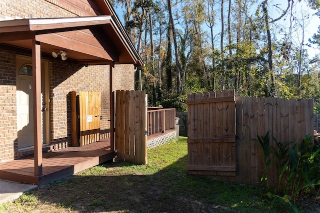 view of yard with a wooden deck