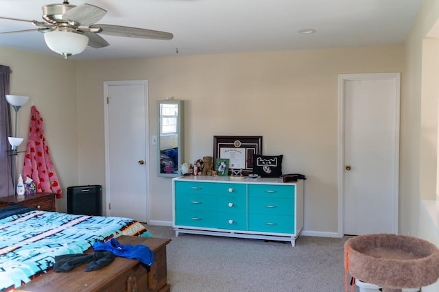 bedroom featuring dark colored carpet and ceiling fan