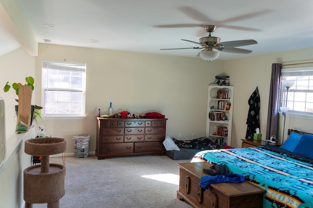 bedroom with vaulted ceiling with beams, ceiling fan, and light carpet