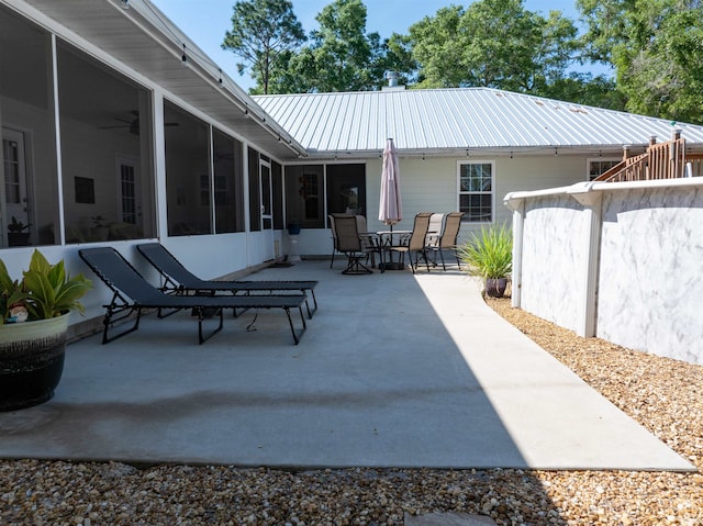 view of patio with a sunroom