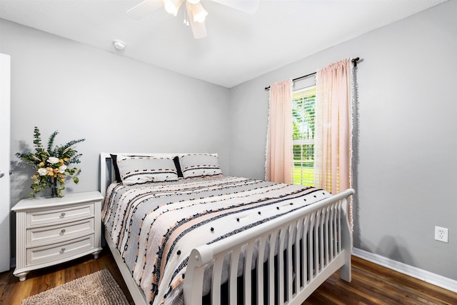 bedroom featuring ceiling fan and dark hardwood / wood-style floors