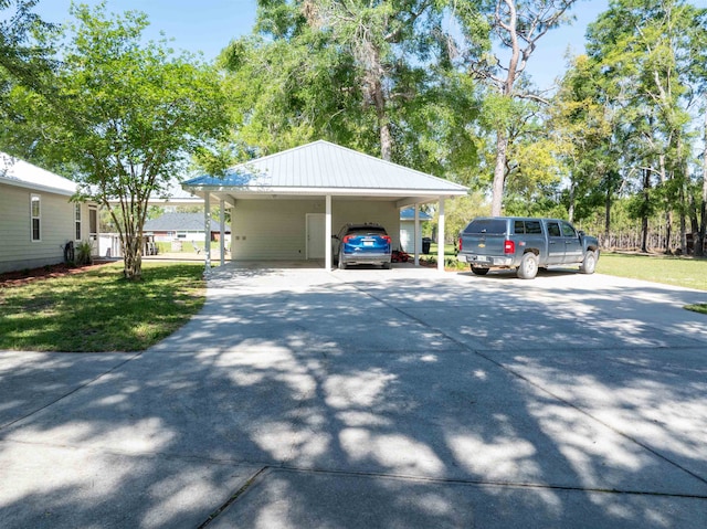 view of vehicle parking with a lawn and a carport