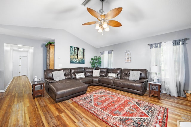 living room featuring lofted ceiling, ceiling fan, and wood-type flooring