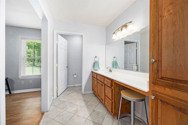 bathroom featuring hardwood / wood-style floors and vanity