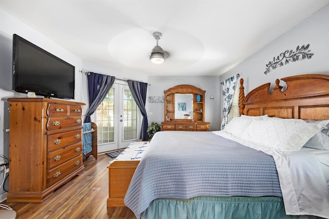 bedroom featuring hardwood / wood-style flooring, ceiling fan, french doors, and access to outside