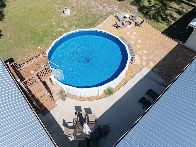 view of swimming pool featuring a patio area