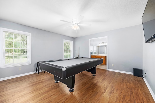 recreation room featuring ceiling fan, a wealth of natural light, wood-type flooring, and billiards