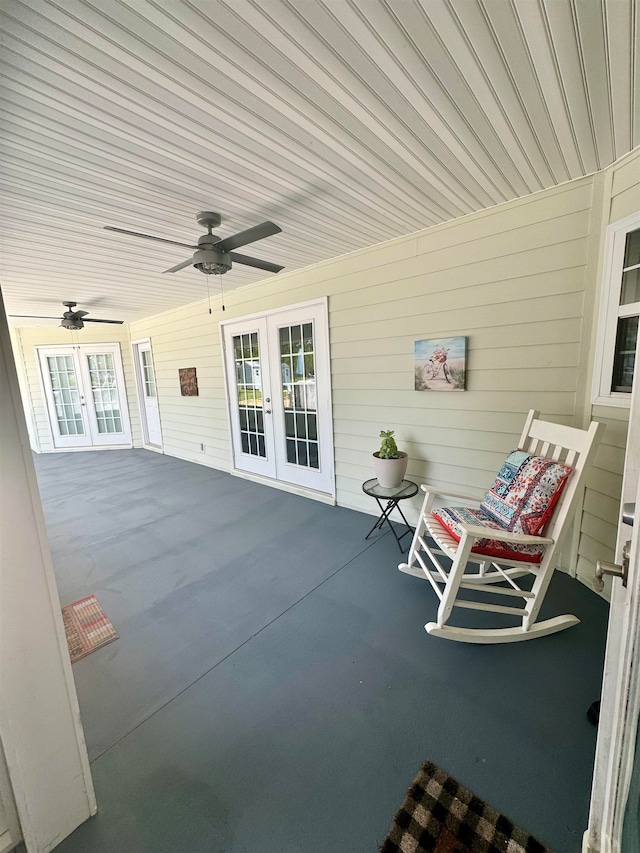 view of patio featuring ceiling fan and french doors