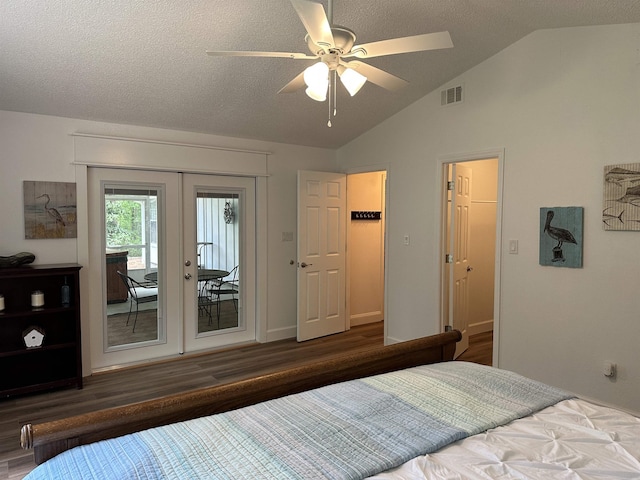 bedroom featuring lofted ceiling, access to outside, a textured ceiling, visible vents, and wood finished floors