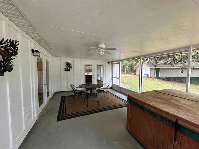 unfurnished sunroom featuring french doors and ceiling fan