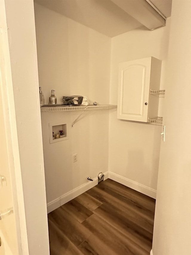 laundry area with hookup for a gas dryer, washer hookup, baseboards, laundry area, and dark wood-type flooring