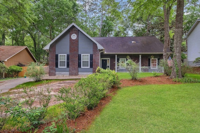 1520 Breamstone Rdg, Tallahassee, FL 32312 - ranch-style house with brick siding, a porch, a front lawn, and roof with shingles