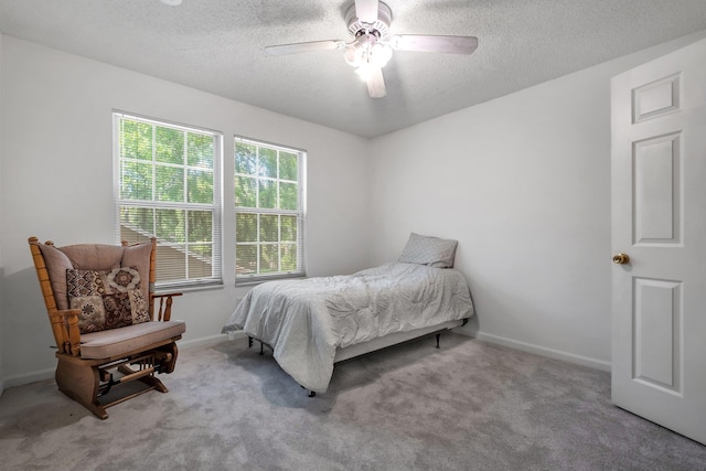 1520 Breamstone Rdg, Tallahassee, FL 32312 - carpeted bedroom featuring a textured ceiling, a ceiling fan, and baseboards