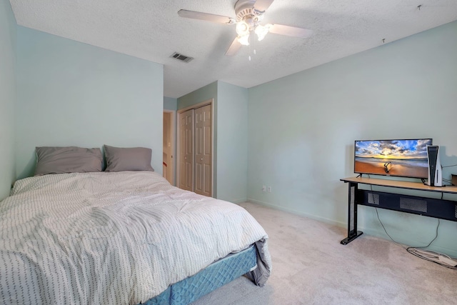 1520 Breamstone Rdg, Tallahassee, FL 32312 - carpeted bedroom with a textured ceiling, a closet, ceiling fan, and baseboards