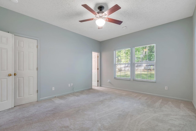 1520 Breamstone Rdg, Tallahassee, FL 32312 - unfurnished bedroom featuring carpet flooring, baseboards, a textured ceiling, and a ceiling fan