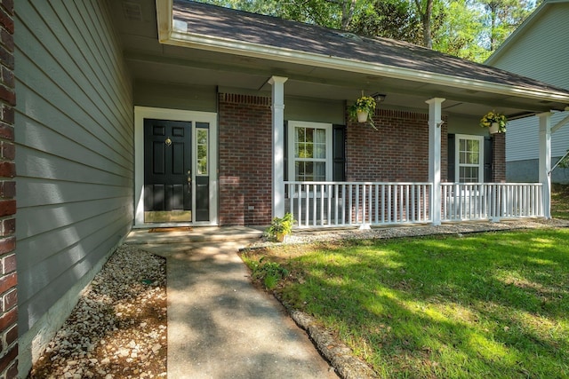 1520 Breamstone Rdg, Tallahassee, FL 32312 - property entrance with covered porch, brick siding, and a yard