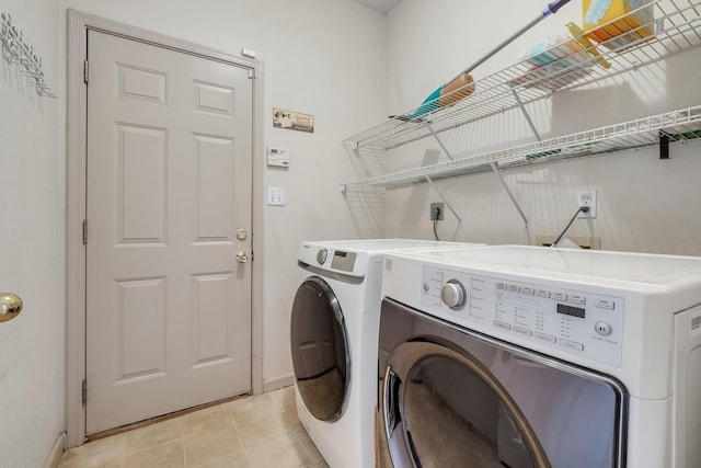 1520 Breamstone Rdg, Tallahassee, FL 32312 - washroom with washer and clothes dryer and baseboards
