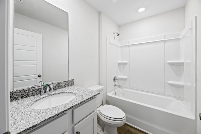 full bathroom featuring shower / tub combination, vanity, and toilet