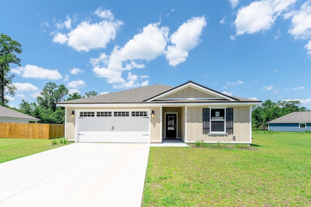 ranch-style home featuring a garage and a front yard