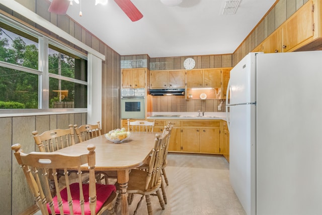 105 Goff St, Perry, FL 32347 - kitchen featuring white appliances, under cabinet range hood, ceiling fan, a sink, and light countertops
