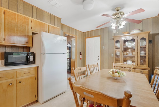 105 Goff St, Perry, FL 32347 - dining area with a ceiling fan and wooden walls
