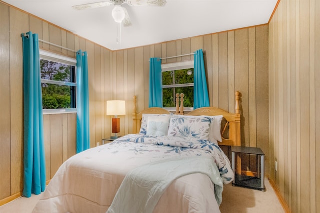 105 Goff St, Perry, FL 32347 - carpeted bedroom featuring wooden walls and a ceiling fan