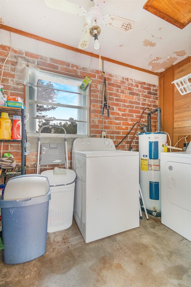 105 Goff St, Perry, FL 32347 - laundry room featuring washer / dryer, water heater, and brick wall