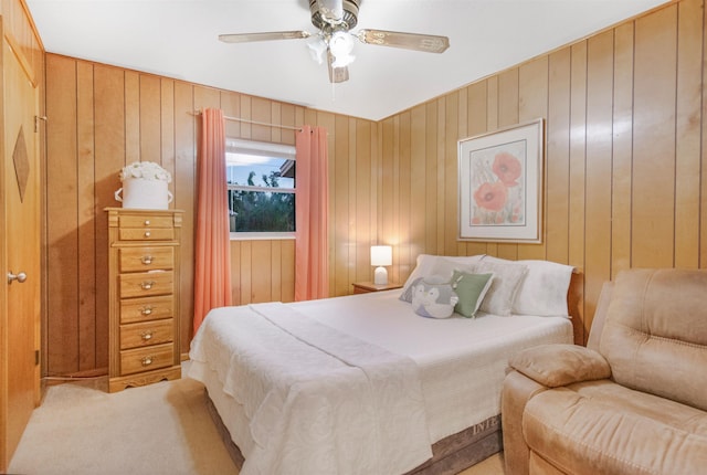 105 Goff St, Perry, FL 32347 - bedroom featuring light carpet, wood walls, and ceiling fan