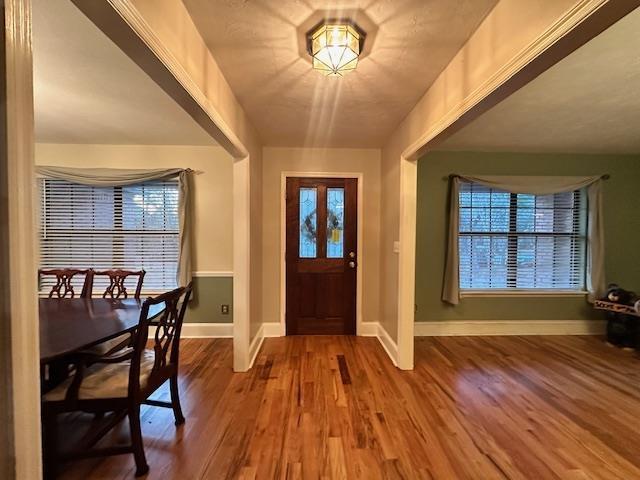 entryway with hardwood / wood-style floors